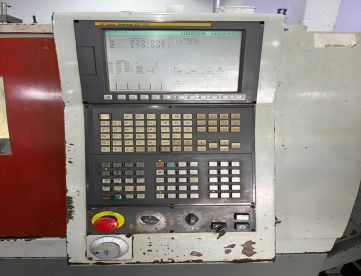 Foto: CENTRO DE TORNEAMENTO ERGOMAT TND180 -COMANDO FANUC-COM TRANSPORTADOR DE CAVACO  ANO 2009