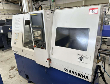 TORNO AUTOMATICO DE CABEÇOTE MOVEL MARCA HANWHA  MODELO ML20H -COM ALIMENTADOR AUTOMÁTICO DE BARRAS - ANO 2001